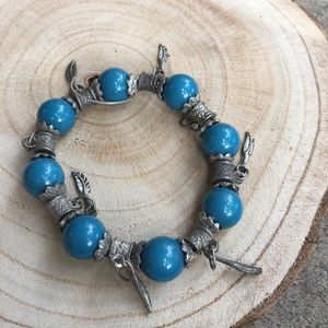 Blue bead and feather bracelet